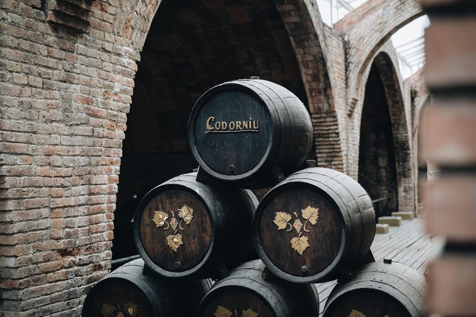 Barcelona: Casa Codorníu Guided Tour with Cava Tastings - Going 20 meters underground on an electric train