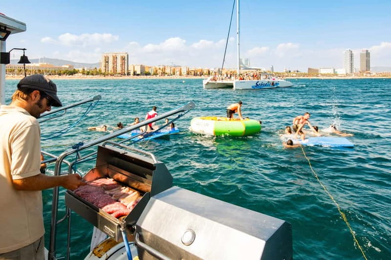 Barcelona: Catamaran Party Cruise with BBQ Meal - Sailing past Barcelona, then heading toward Badalona