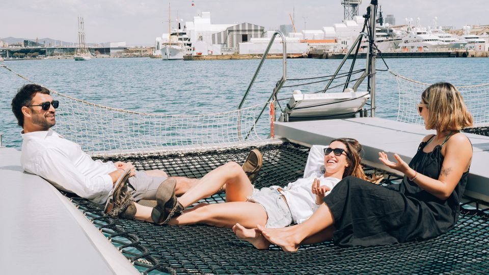 Barcelona: Daytime or Sunset Catamaran Cruise with Music - The best photo spots: hammocks, rails, and the wave-bar vibe