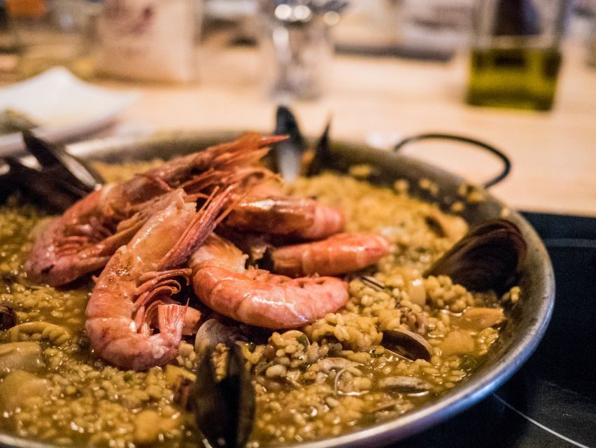 Barcelona: Paella Cooking Workshop and Market Tour - Unlimited wine, beer, and soft drinks: the fun part and the practical part