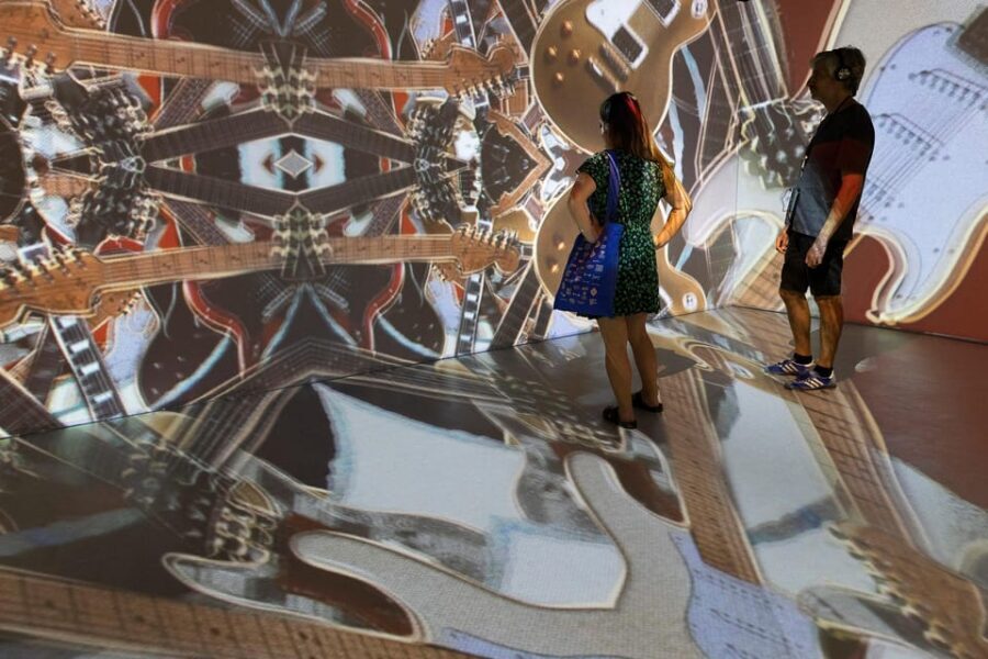 Barcelona: Rock Museum- Guitar Legends Hall - The authentic guitar wall: Rolling Stones, Metallica, Led Zeppelin, Queen