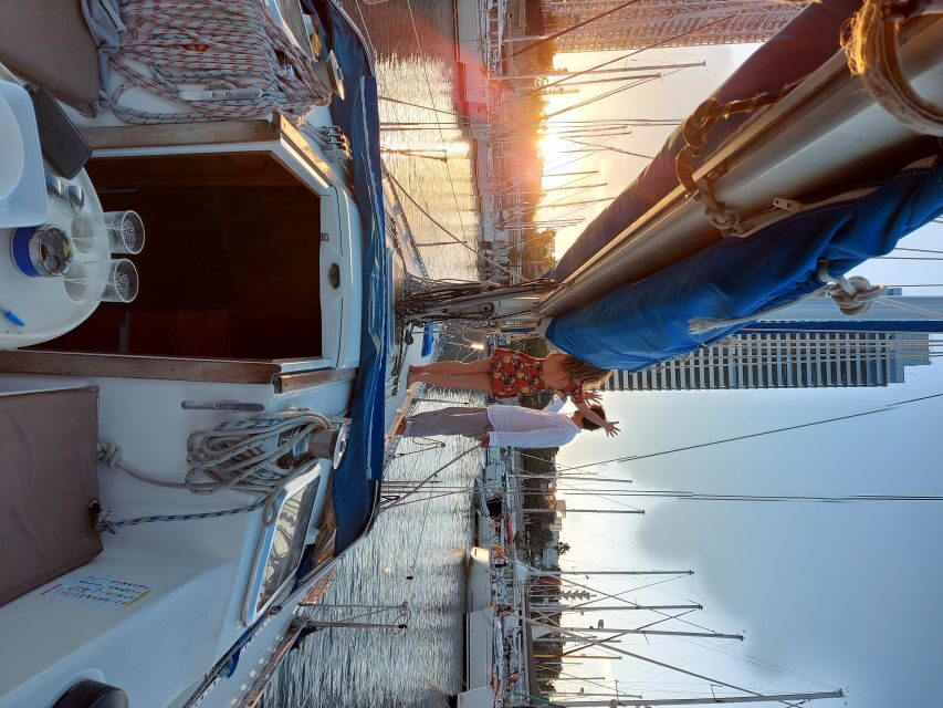 Barcelona Sailing Tour Drinks, snacks Swim & Stunning Views - Boat comfort that actually helps: mats, blankets, and easy hanging out