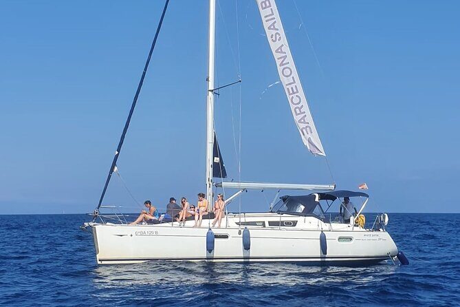 Barcelona Sunset Sailing with Open Bar of Cava and Snacks - Deck comfort, wind, and seasickness: bring layers and a plan