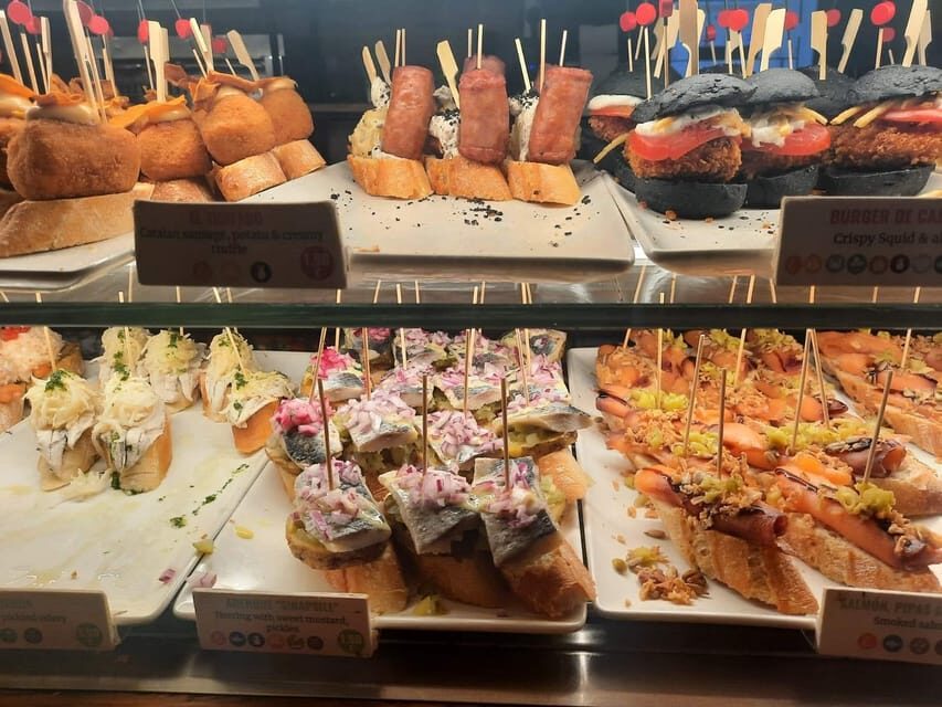 Barcelona: Tapas and Pintxos Tour with Crema Catalana - Meet Guide Vicky and Get Off the Tourist Track
