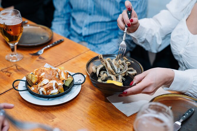Barcelona Tapas Food Walking Tour with Wine in El Born - Gothic Quarter first stop: family tapas, wine pairings, and quick wins