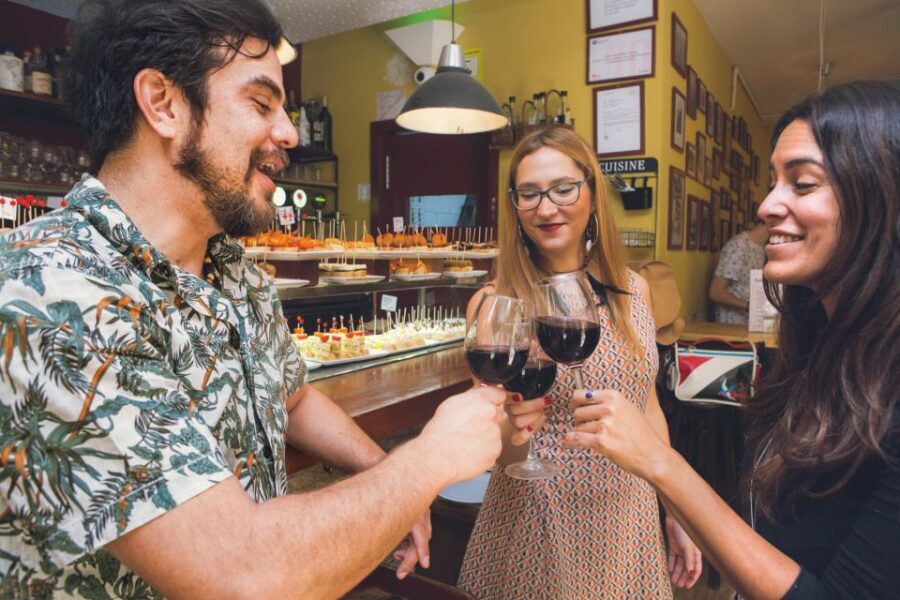 Barcelona Tapas & Wine Private Tour in Traditional Taverns - Carrer de Montcada: beef tapa with a red wine scene