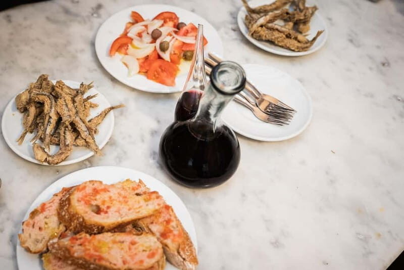 Barcelona: The Ultimate Local Tapas & Drinks Food Tour - Montaditos, Tomato Salad, and Pimientos de Padrón: Real-World Variety
