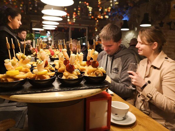 Food & Drink Private Tour of Barcelona in Traditional Taverns - Stop 4: La Boquería market moment and acorn-fed Ibérico ham