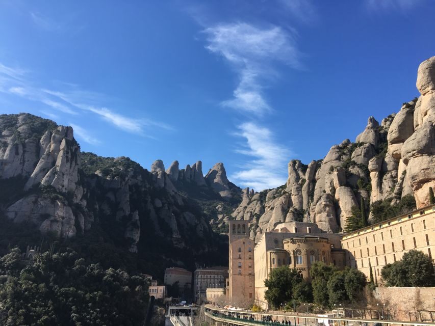 From Barcelona: Montserrat Full-Day Trip with Guided Hike - Santa Maria de Montserrat and La Moreneta: the spiritual first act