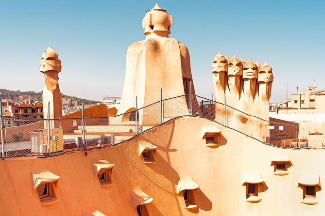 Gaudi's Casa Batlló and La Pedrera with Chocolate Tasting - Inside La Pedrera: courtyard, house flow, and roof chimneys