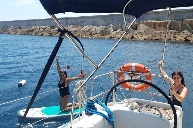 Private sailing and paddlesurfing tour with skipper up to 11 people - Barceloneta Beach from offshore: the energy plus the calm