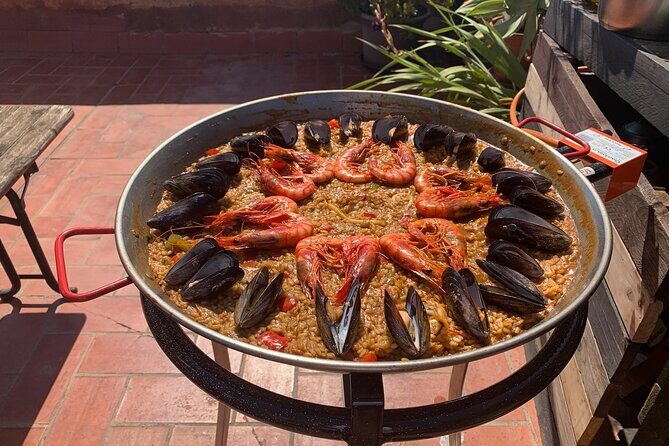 Rooftop Paella Seafood Cooking Class Experience in Barcelona - Dinner on the rooftop terrace: sunset over the old port